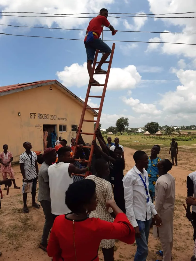 Participants observing an outdoor practical demonstration